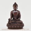 Front view of handcrafted Medicine Buddha Figurine in oxidized copper.