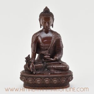 Front view of handcrafted Medicine Buddha Figurine in oxidized copper.