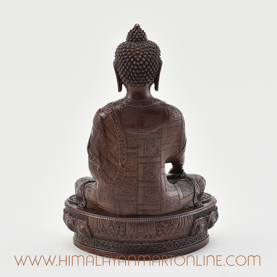 Back view of Shakyamuni Buddha Figurine featuring traditional patterns