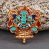 Front view of handcrafted Cheppu Face Ghau prayer box pendant