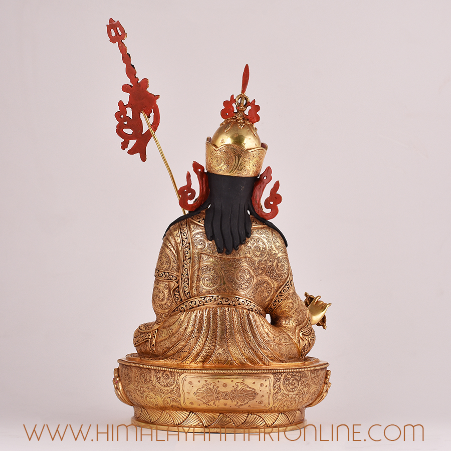 Back view of Guru Rinpoche handcrafted statue, showing detailed robes and craftsmanship.