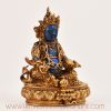 Right side view of Lapis Inlaid Yellow Dzambhala Statue showing handcrafted copper details and gemstone inlay