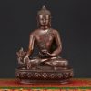 Medicine Buddha Idol handcrafted in Nepal, seated in meditation holding a healing bowl symbolizing compassion and wellness.