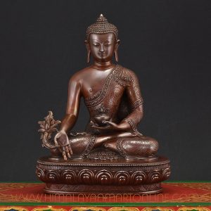 Medicine Buddha Idol handcrafted in Nepal, seated in meditation holding a healing bowl symbolizing compassion and wellness.